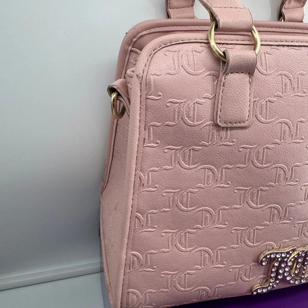 Y2K Juicy Couture satchel in pink, features an all-over embossed 